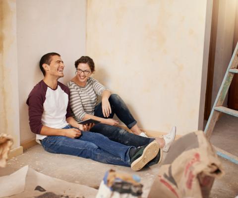 Couple taking a break during home renovations